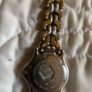 Tag Heuer watch.  Needs battery and band fixed. All pieces on band WG-1312-0
